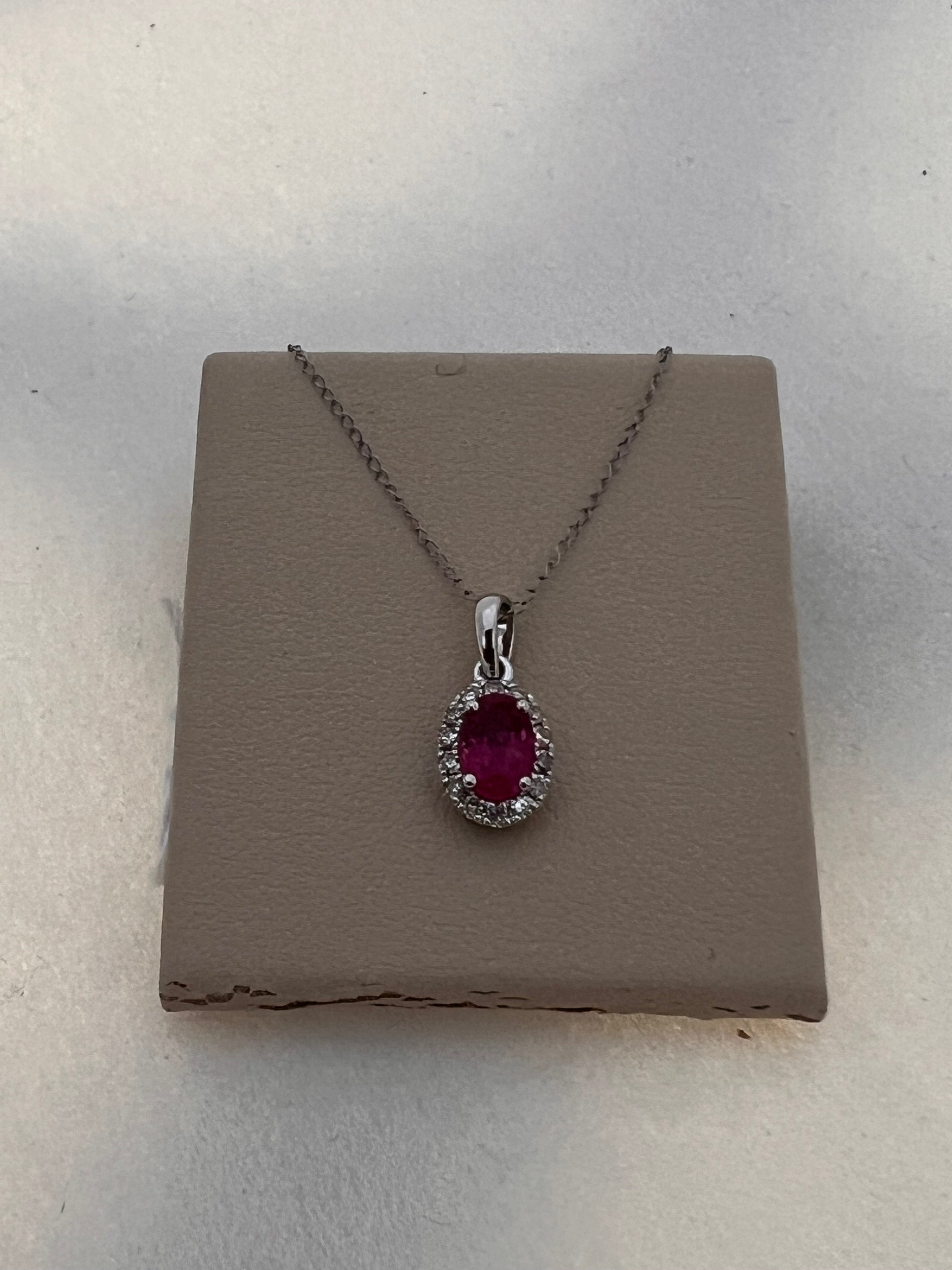 Oval Ruby & Diamond Halo Pendant in 14kt White Gold