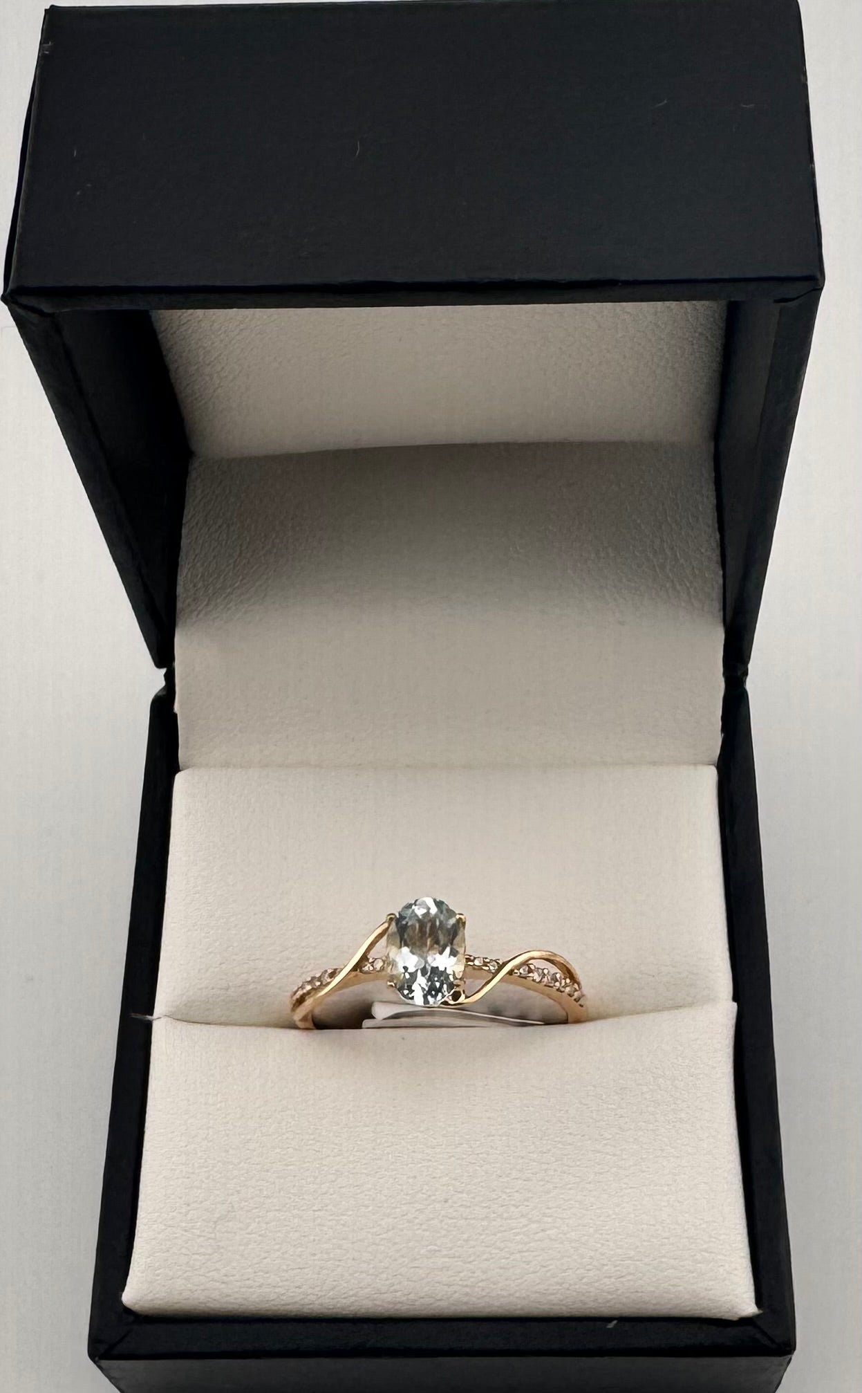 10K Yellow Gold Oval Aquamarine Ring with Diamond Swirl Accent
