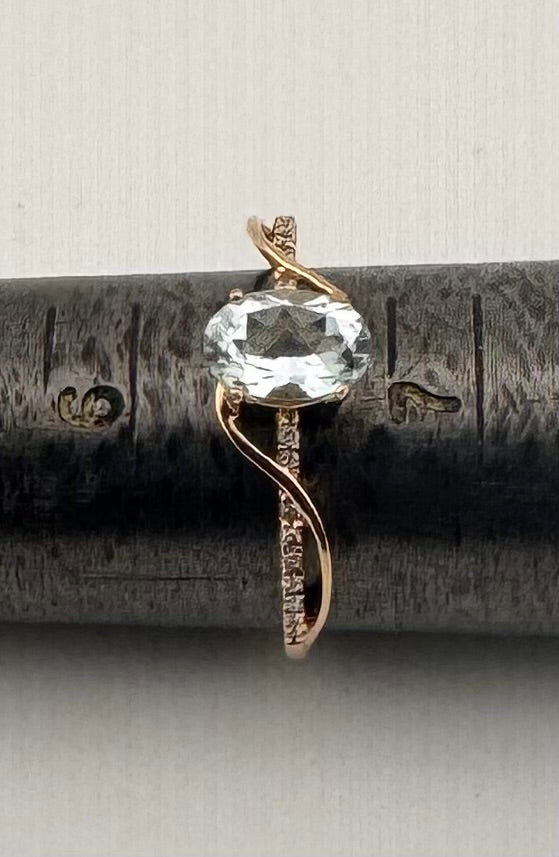 10K Yellow Gold Oval Aquamarine Ring with Diamond Swirl Accent