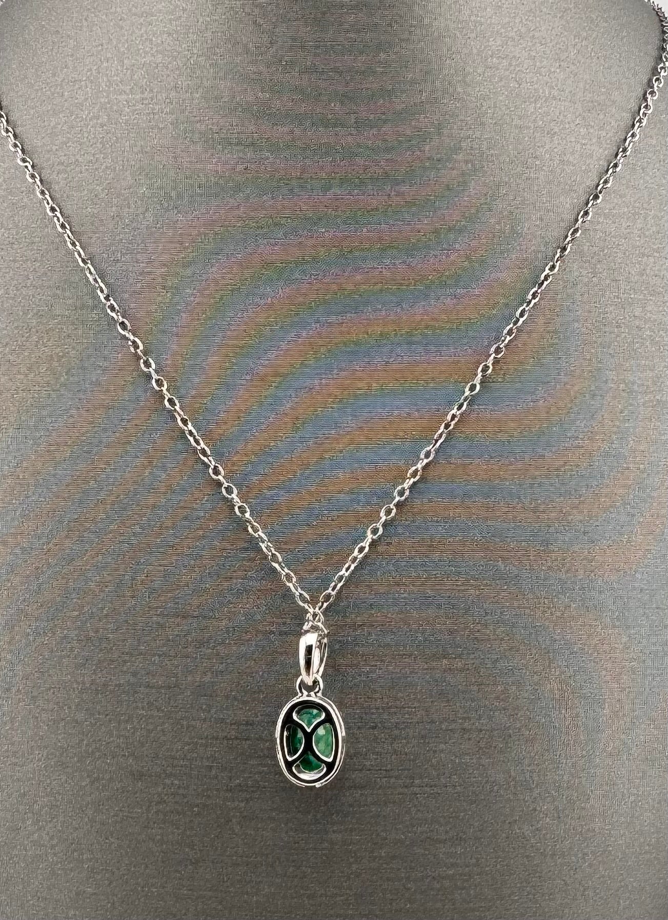 14K White Gold Oval Emerald & Diamond Halo Pendant | .66 ct Emerald, .10 ctw Diamonds