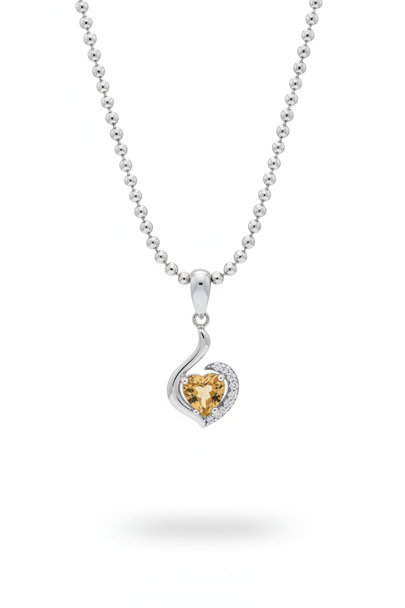 Heart shaped citrine and white topaz swirl pendant necklace in sterling silver suspended on white background
