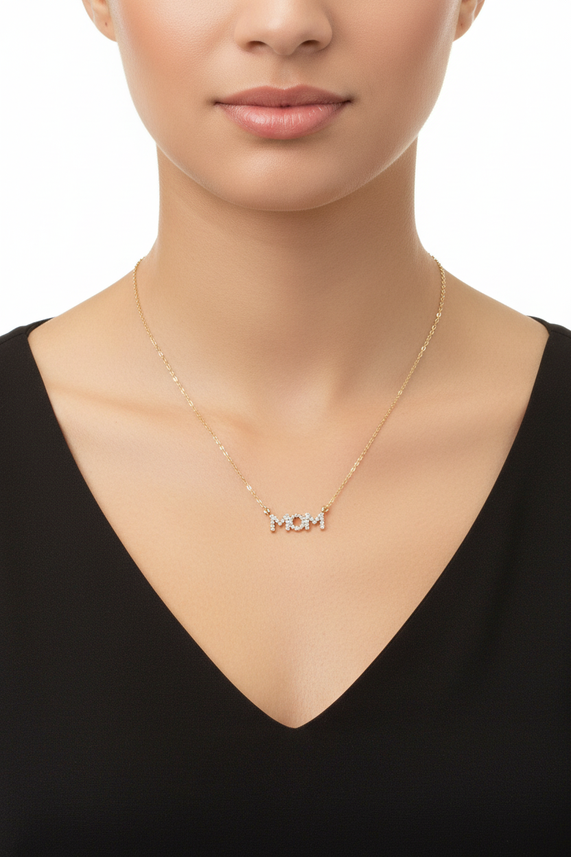 Gold-tone crystal pavé MOM necklace worn on model showing true to scale 18 inch length