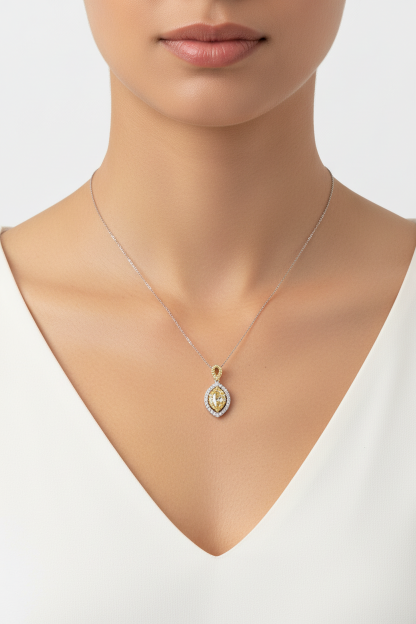 14K two-tone fancy yellow marquise diamond double halo pendant necklace worn on model