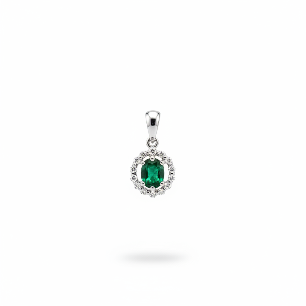 14K white gold oval emerald and diamond halo pendant on white background