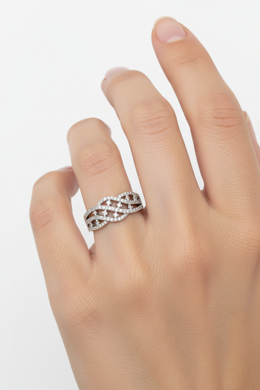 14K white gold pavé diamond braided band ring worn on model's finger