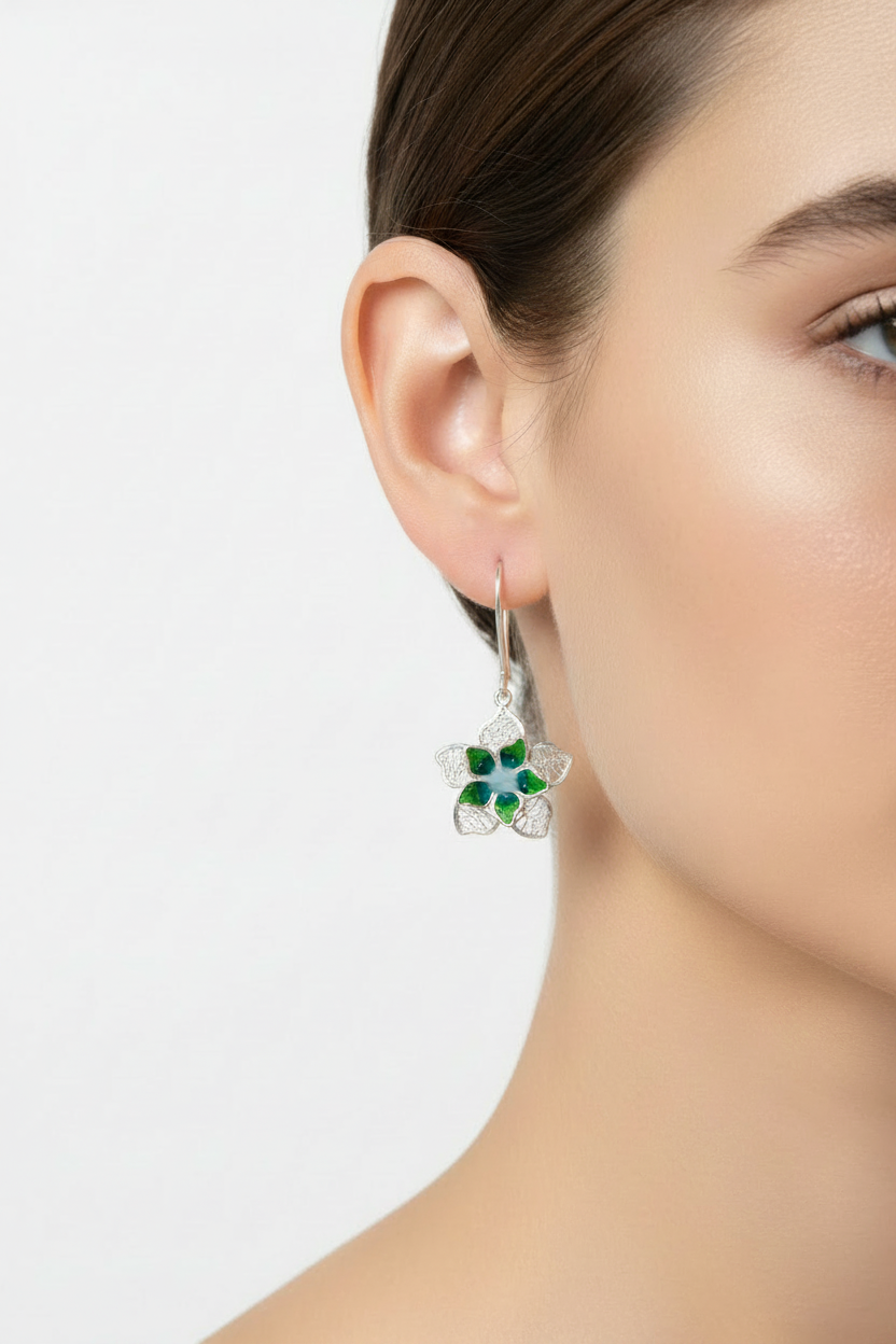 Sterling silver hand-spun filigree green enamel flower drop earrings worn on model