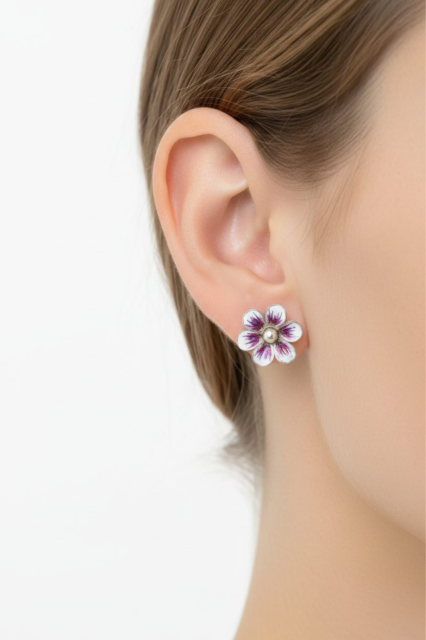 Sterling silver pink and white enamel flower stud earrings worn on model