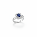 14K white gold oval blue sapphire double diamond halo ring with twisted split shank suspended on white background