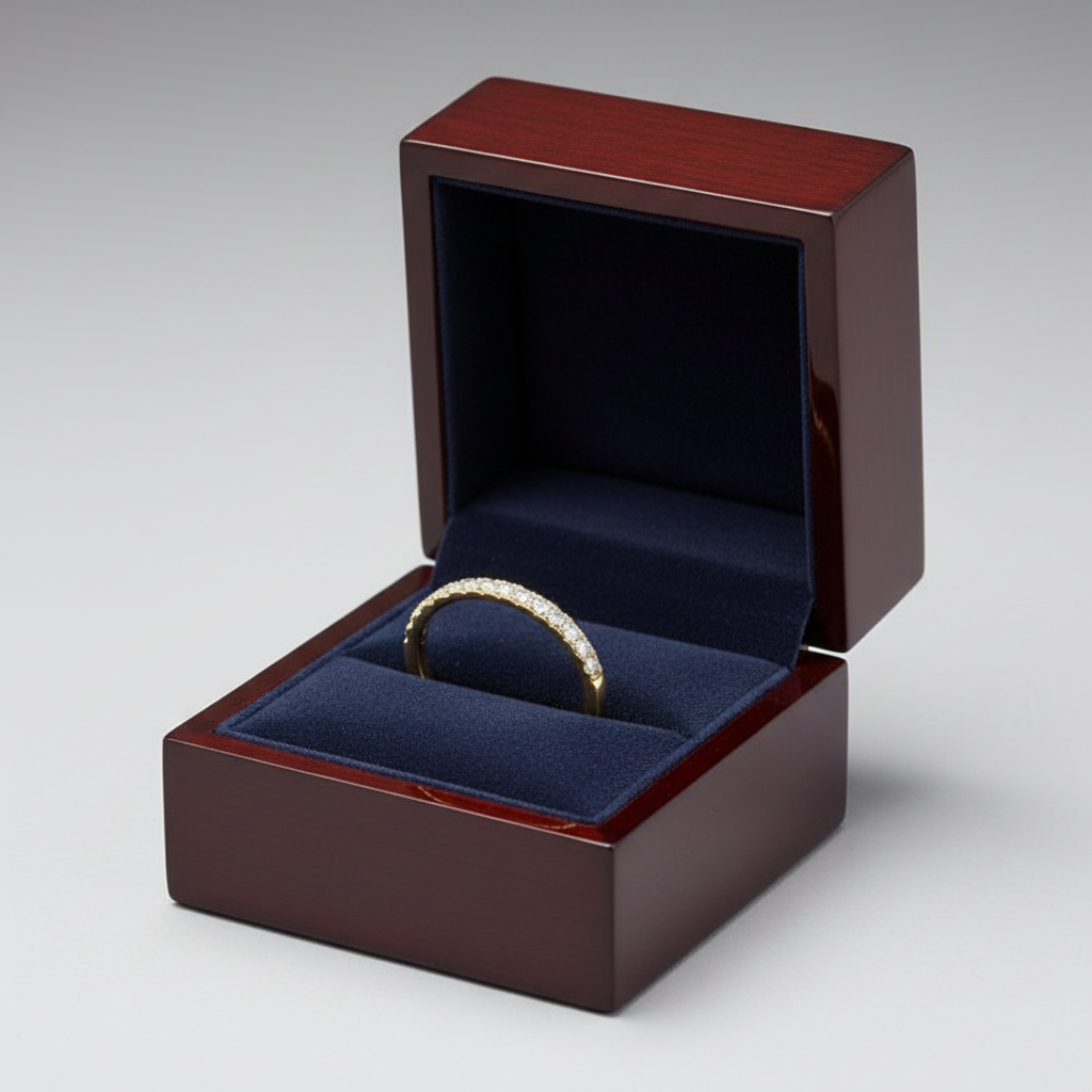 14K yellow gold micro-pavé straight diamond wedding band displayed in a luxury velvet ring box