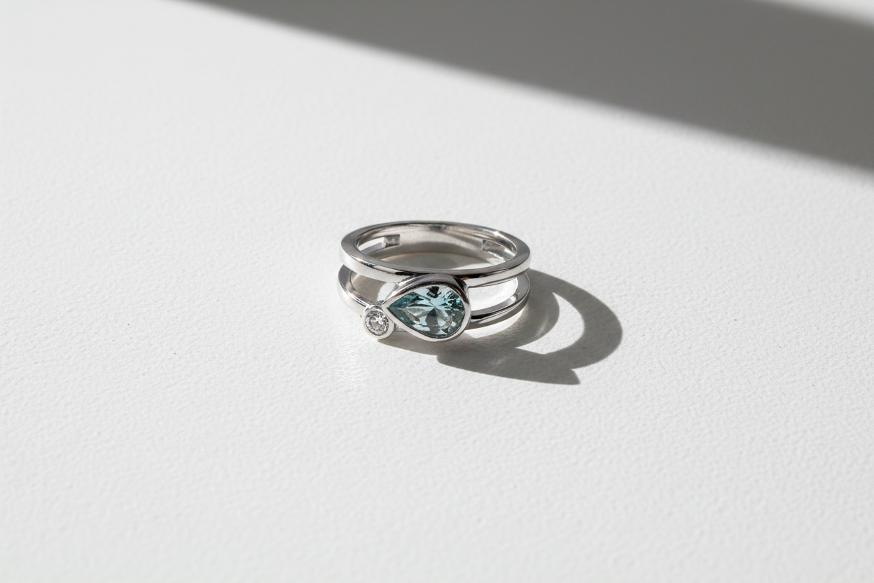 10K White Gold Pear Aquamarine & Diamond Minimalist Ring modern sleek flat lay