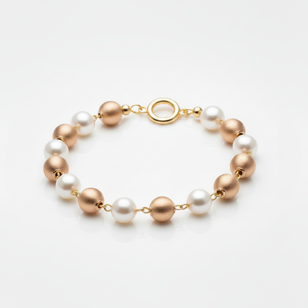 Pearl and rose gold bead station bracelet with ring clasp on white background