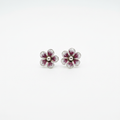Sterling silver hand-spun filigree pink and white enamel flower stud earrings on white background
