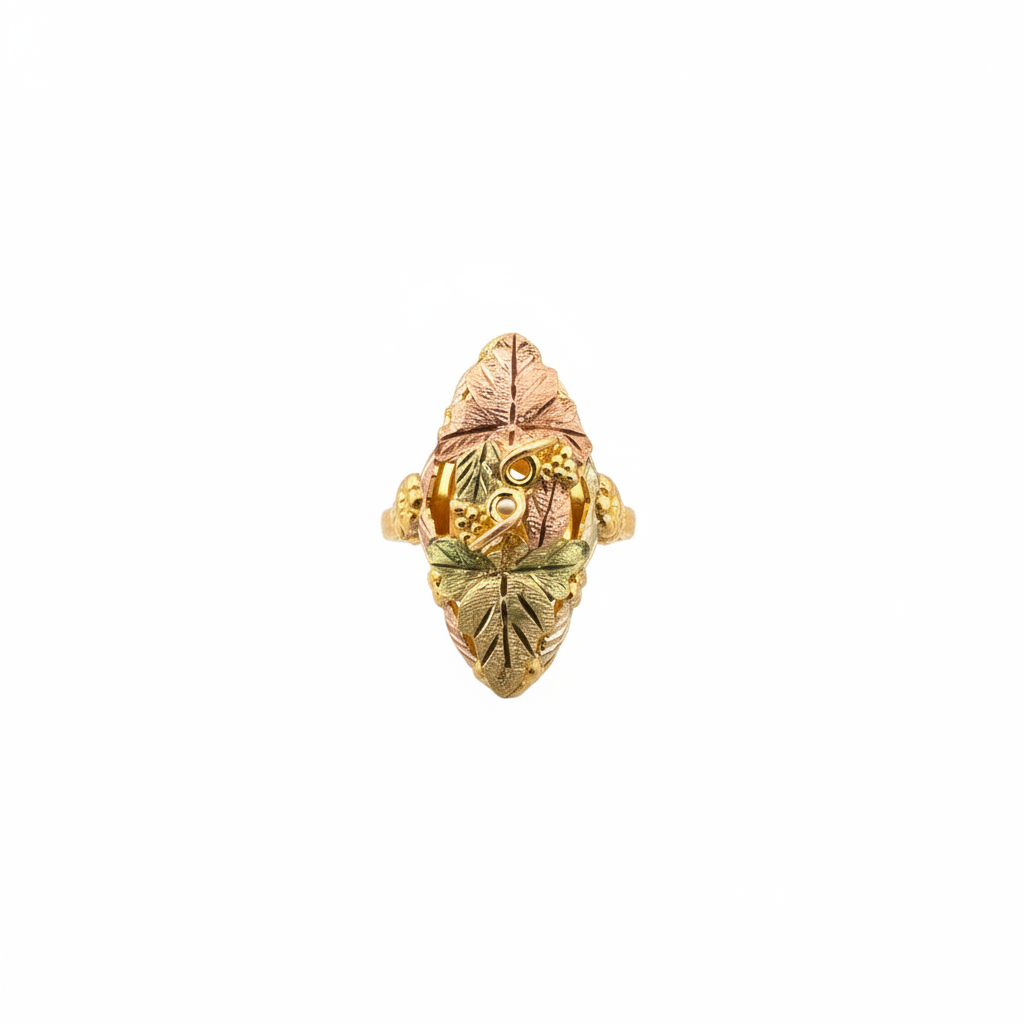 Black Hills Gold ladies ring with tri-color grape and leaf design on white background