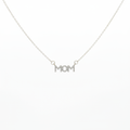 Silver-tone crystal pavé MOM letter bar necklace suspended on white background