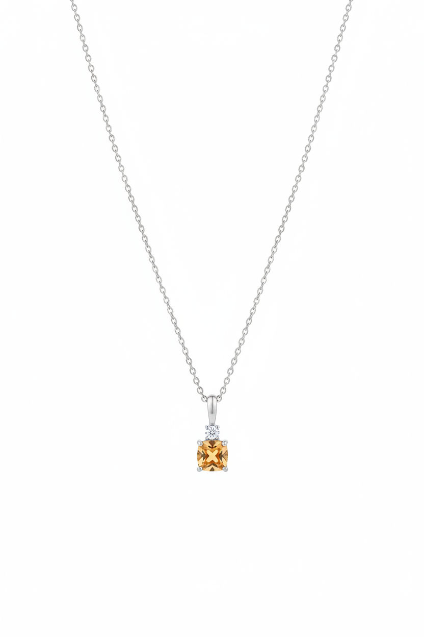 Cushion cut citrine and diamond pendant necklace suspended on white background, true to original piece