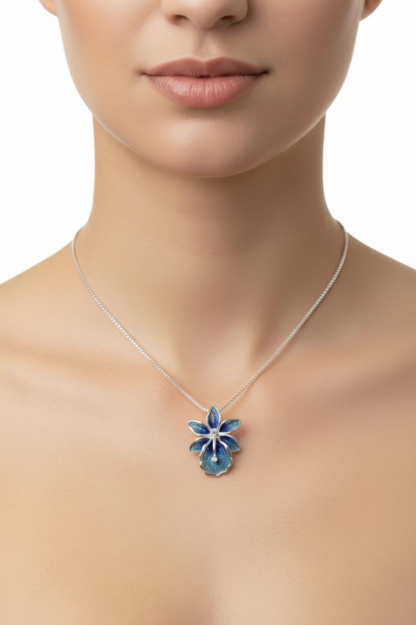 Sterling silver hand-spun filigree blue enamel flower pendant necklace worn on model at true to scale size