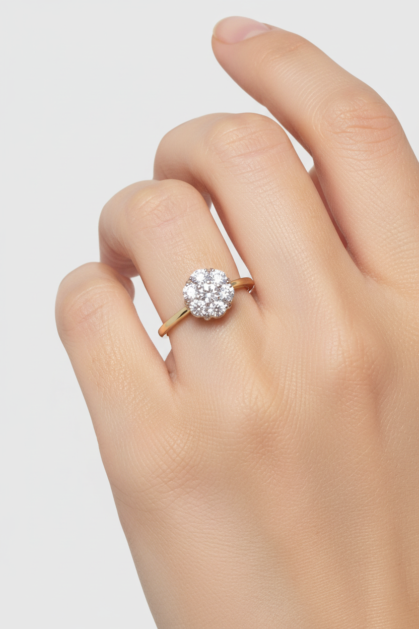 14K yellow gold diamond flower cluster ring worn on model's finger