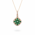 14K rose gold cushion emerald cluster and diamond halo pendant on white background