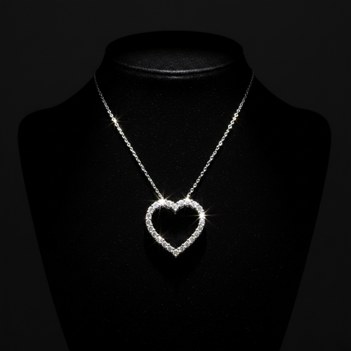 1/2ctw open heart diamond pendant necklace in 10kt white gold on black velvet with dramatic moody lighting